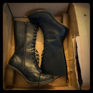Doc Marten high heel laced up boots.